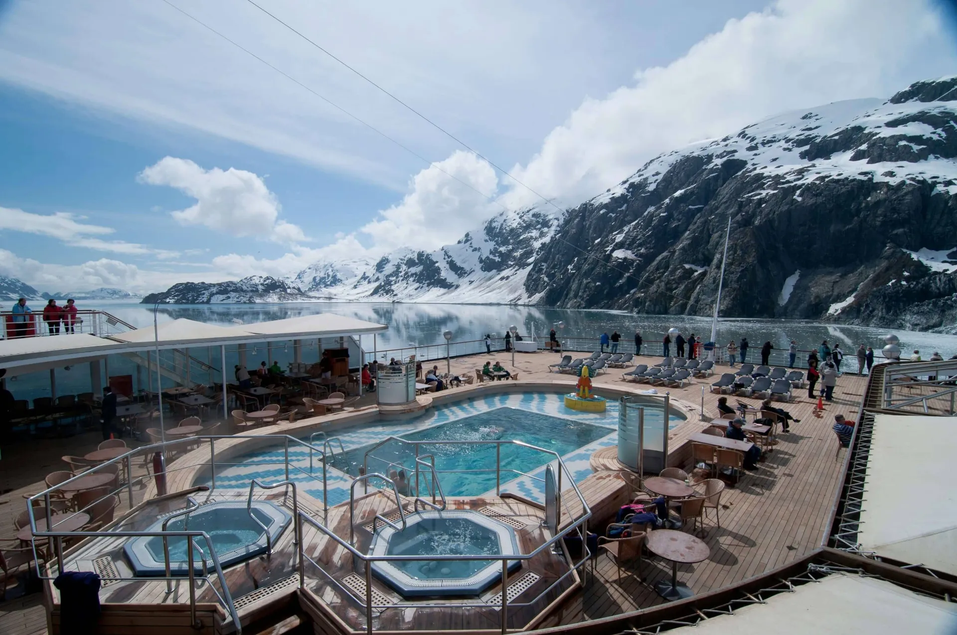 A cruise ship before a towering Alaskan glacier in Glacier Bay