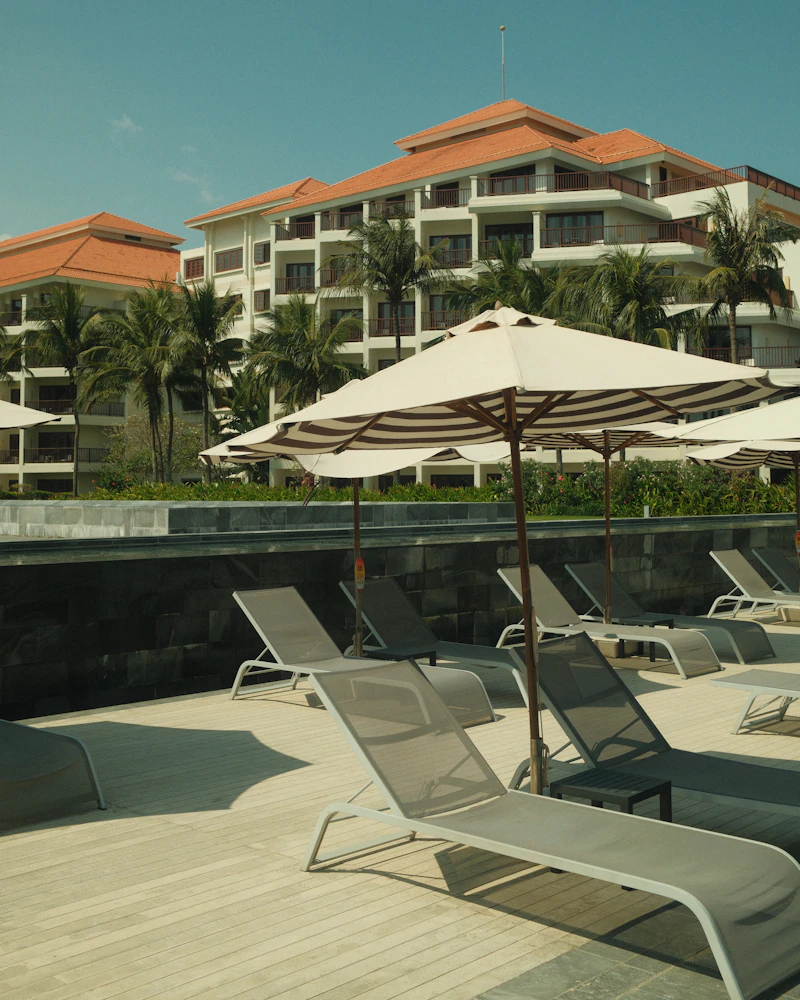 A resort pool and beach lounger, Dominican Republic