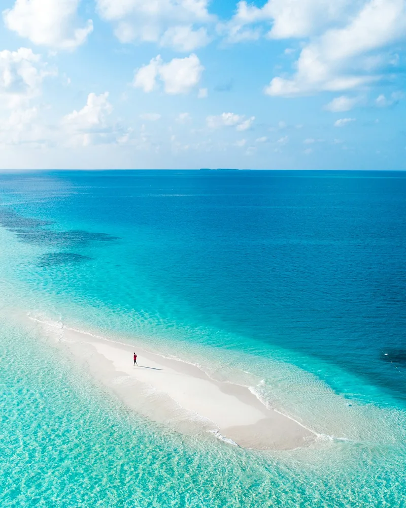 A tiny sandbank in turquoise water, Maldives