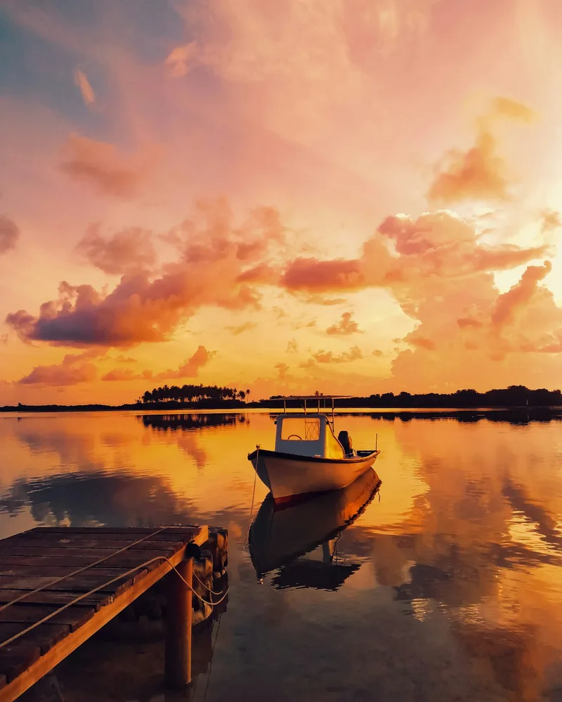 A traditional dhoni at sunset, Maldives