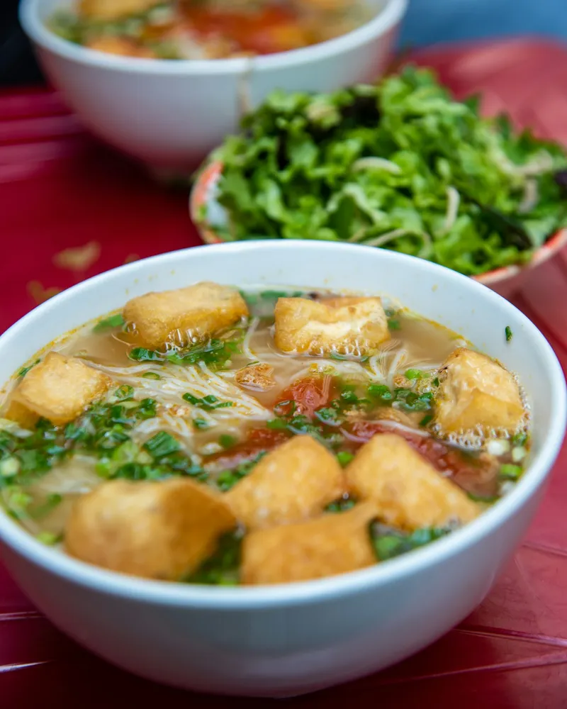 A pho stall at dawn, Vietnam