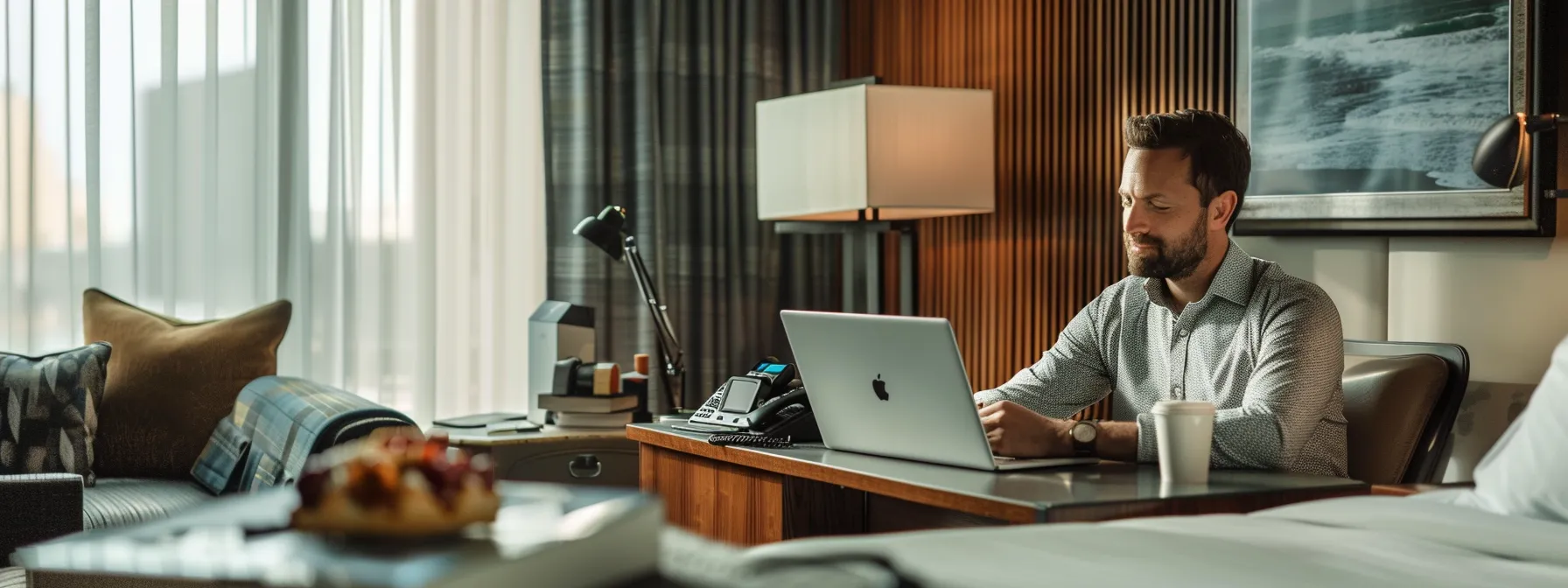 a business traveler sitting at a sleek desk in a modern hotel room in cleveland, surrounded by technology gadgets and healthy snacks, demonstrating a focus on productivity and wellness during the stay.