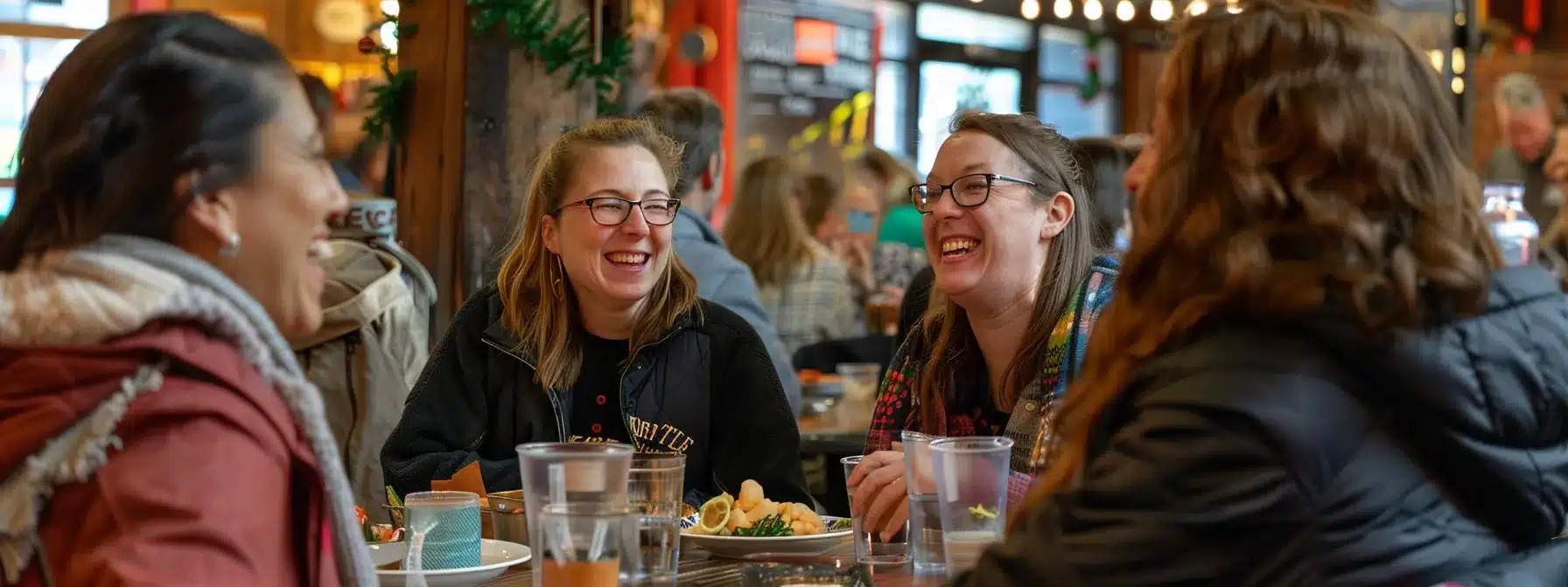 a group of friends laughing and enjoying a personalized food tour in cleveland, savoring diverse culinary delights and exploring the city's vibrant food scene.