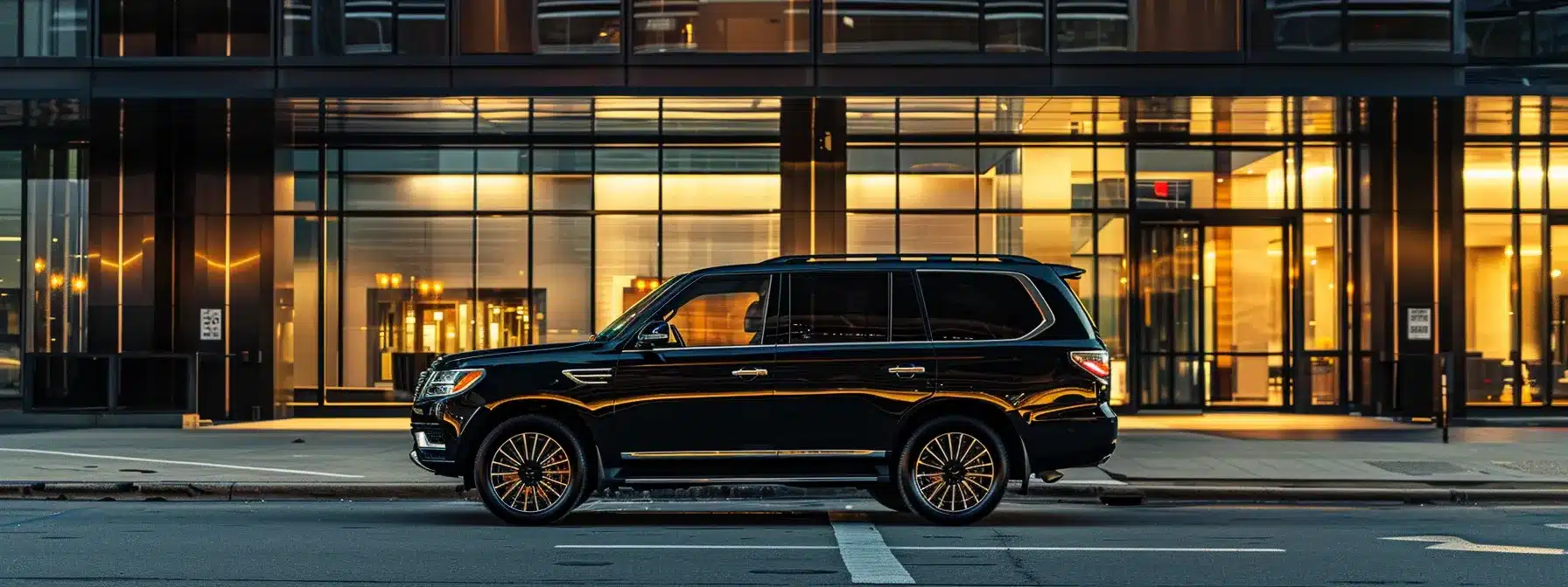a luxurious black suv with tinted windows waiting outside hopkins airport, ready to transport passengers to iconic cleveland landmarks like the rock and roll hall of fame.