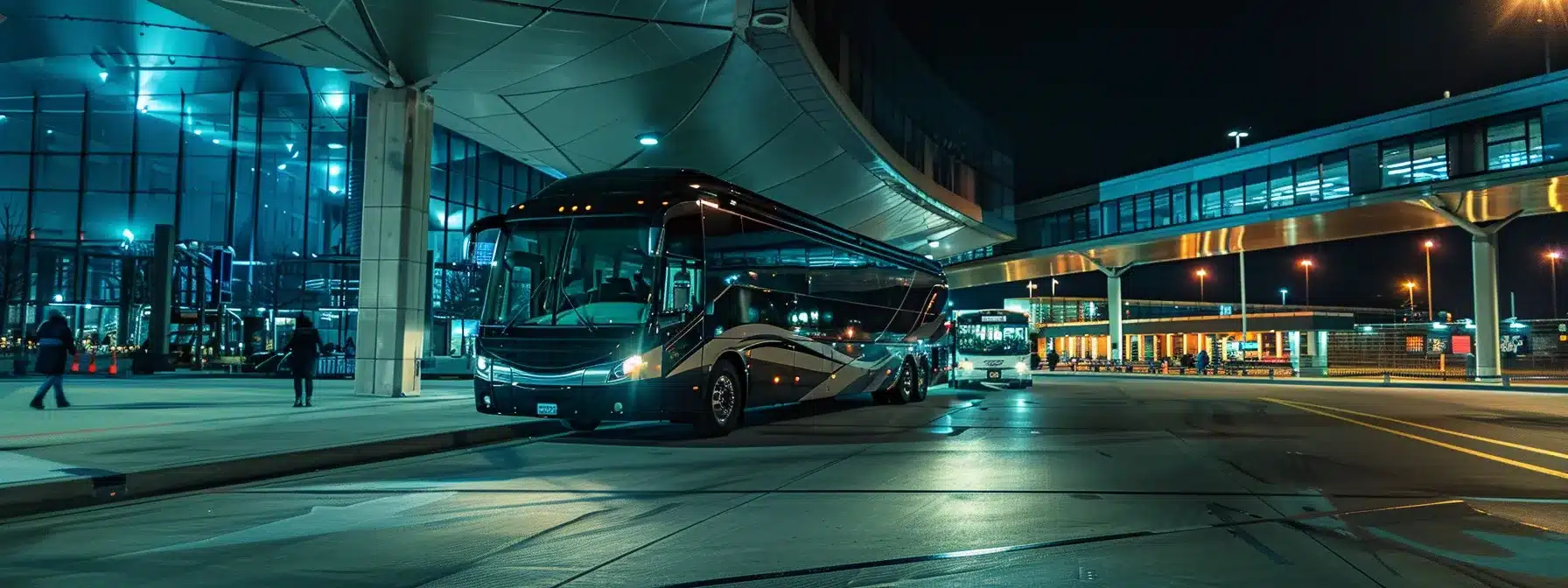 a luxury coach parked outside cleveland hopkins international airport, offering a glamorous transportation option for a bachelorette party group.