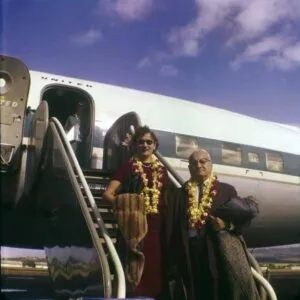 Peter and Mary Chima arriving in Hawaii wearing leis